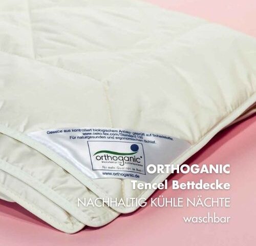 Orthoganic Tencel Bettdecke vor rosa Hintergrund